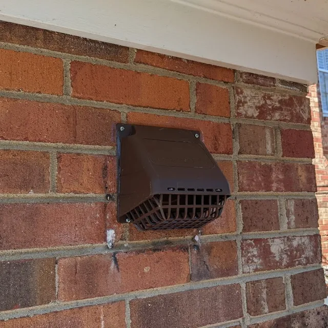 Plastic vent cap on home exterior
