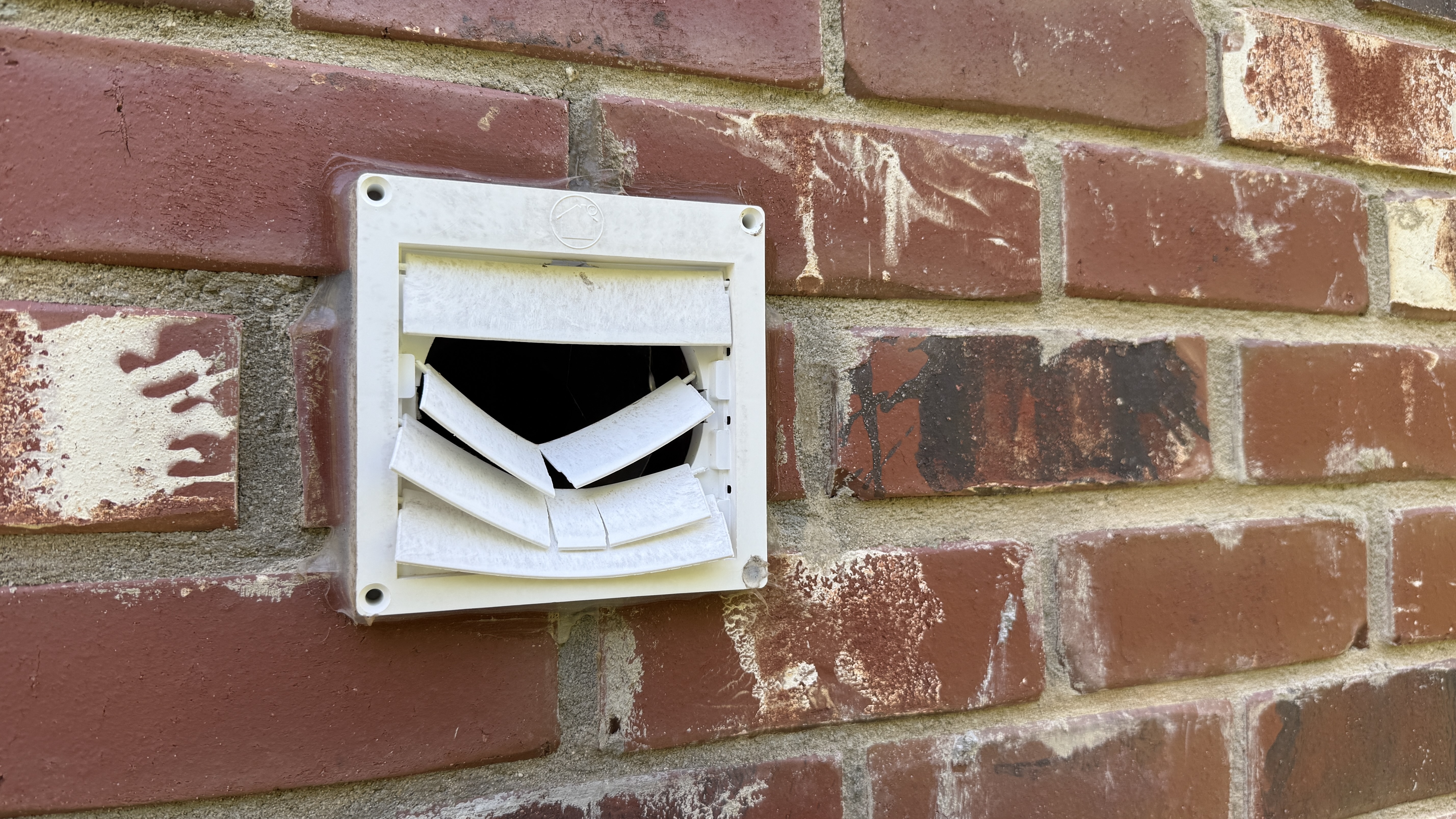 Broken exterior dryer vent cover repair in Greensboro NC
