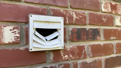 Broken exterior dryer vent cover repair in Greensboro NC