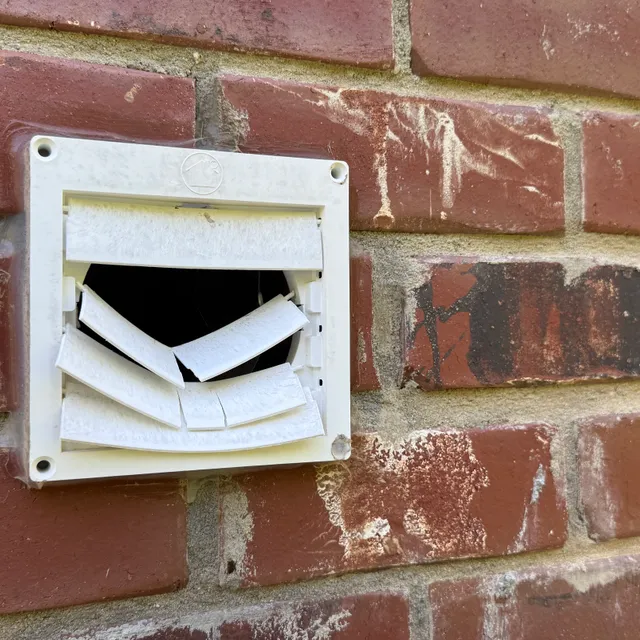 Broken exterior dryer vent cover repair in Greensboro NC