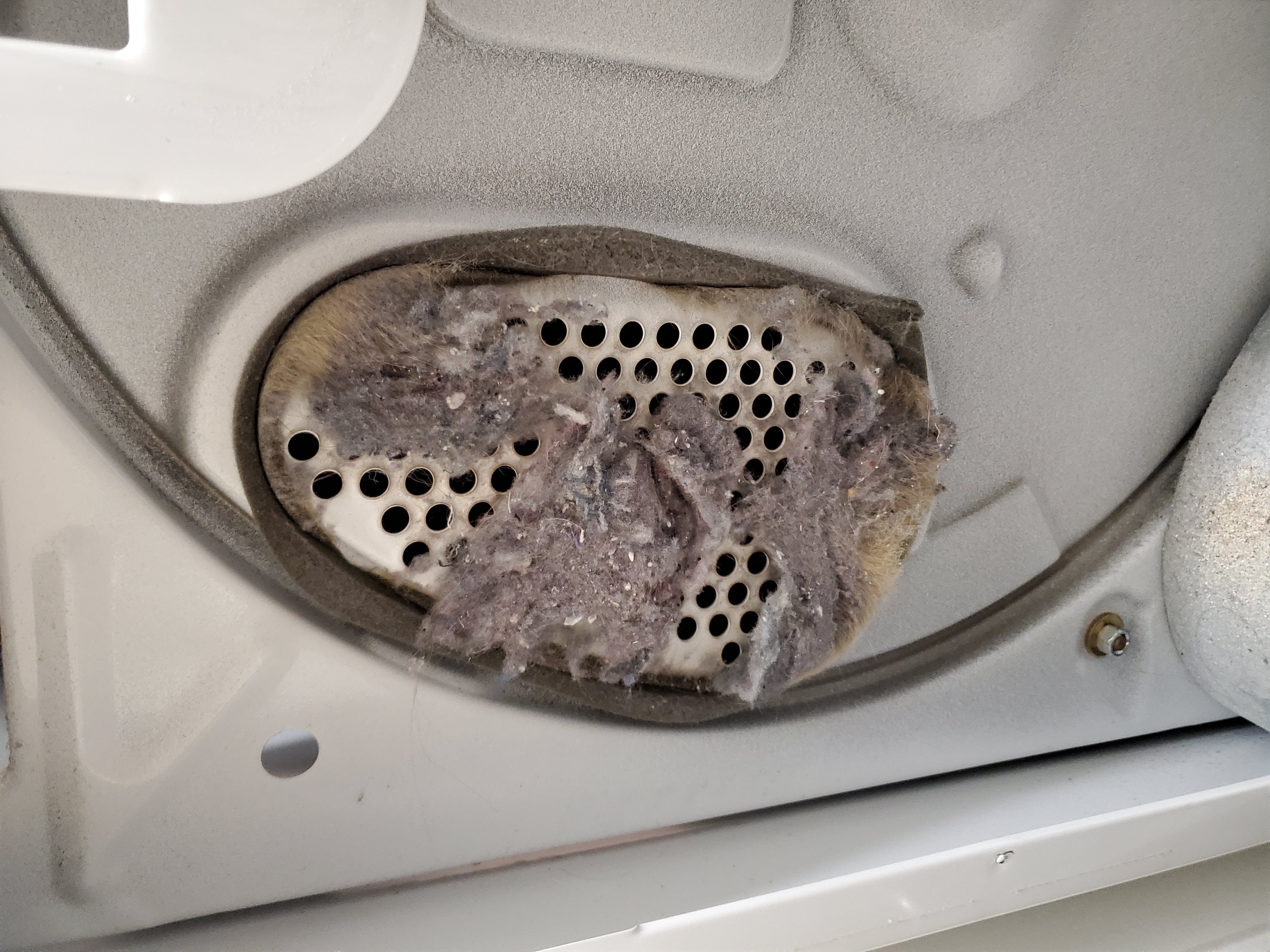 Clogged dryer air intake with lint buildup