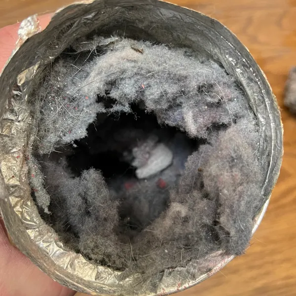 Clogged transition hose before cleaning Stone Mill Village