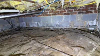 Northern Shores crawlspace after lint cleanup, ready for a new metal dryer vent