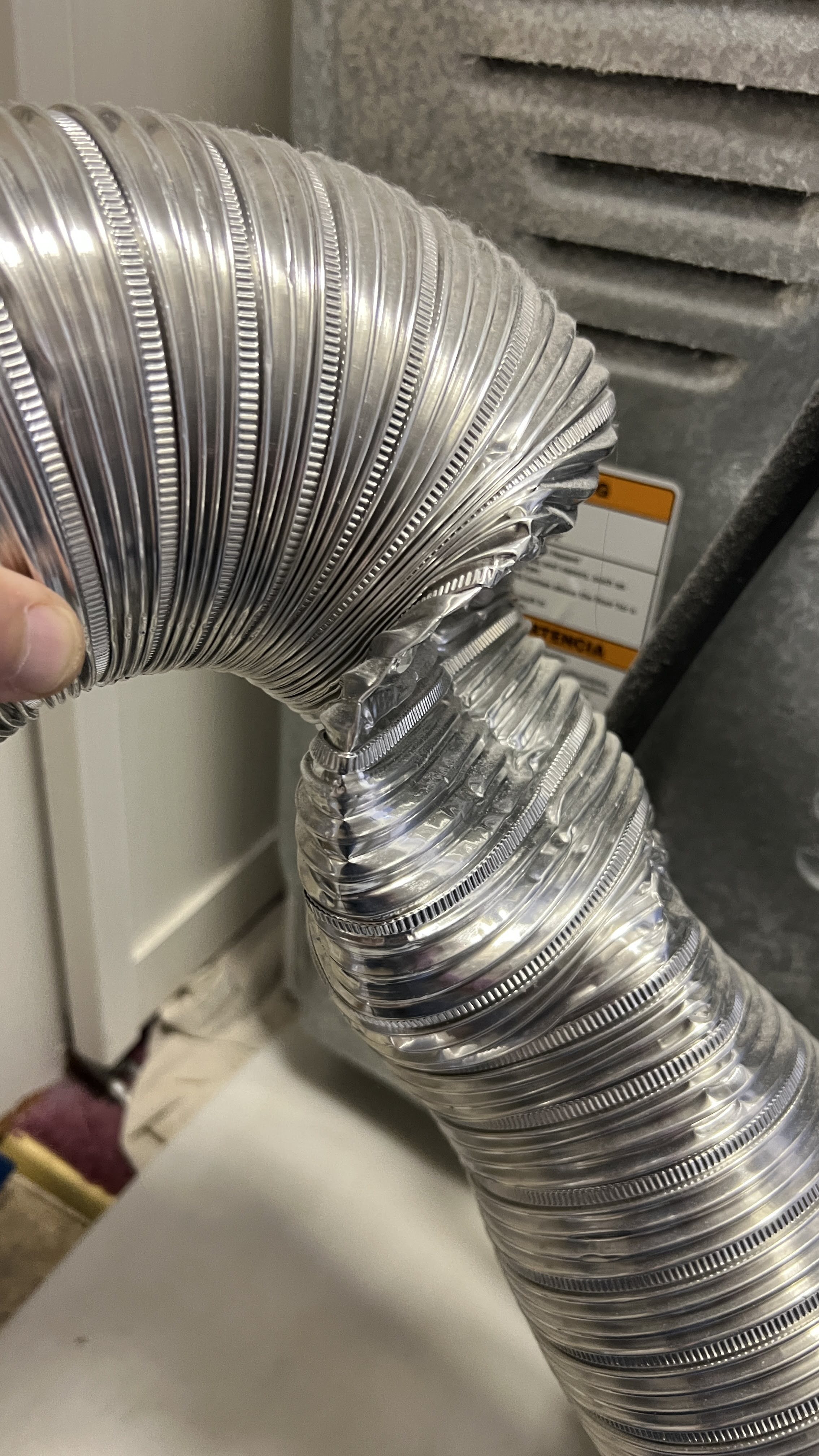 Crushed semi-rigid dryer transition hose restricting airflow