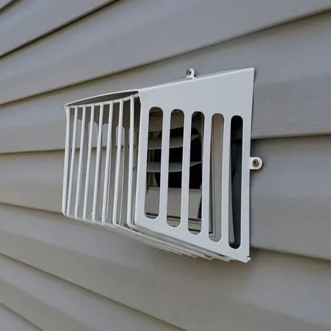 Defender metal bird guard on bathroom exhaust vent prevents future nesting