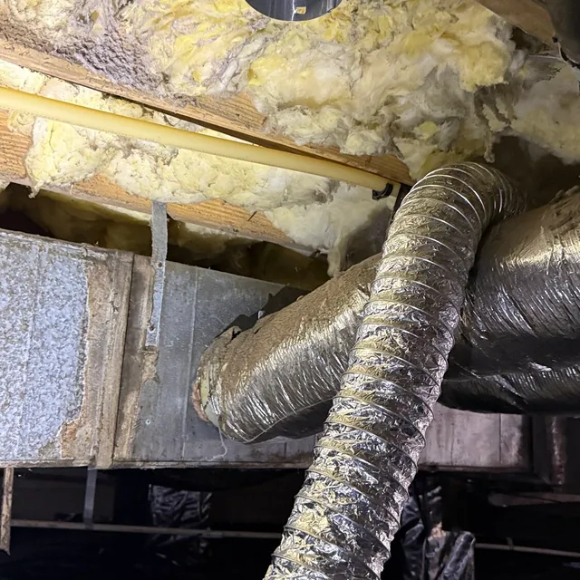 Disconnected dryer vent flex blowing into a Creekridge Eden crawlspace