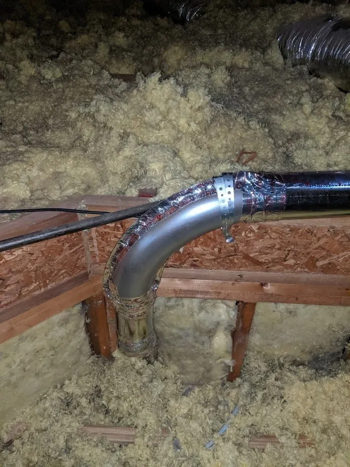 Dryer elbow attic installation