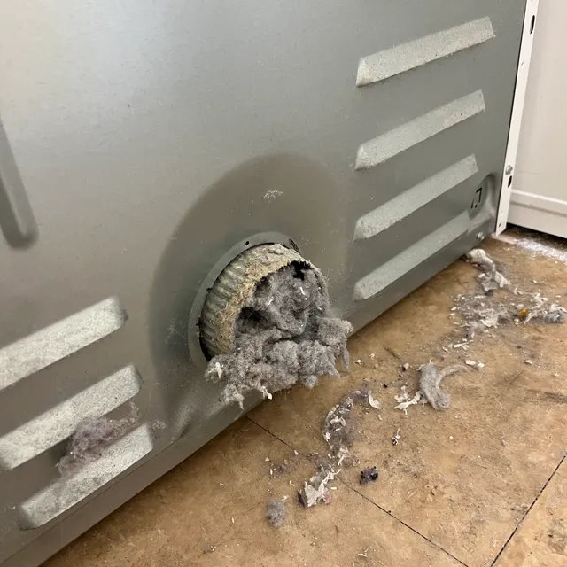 Lint backup at dryer exhaust path inside the machine