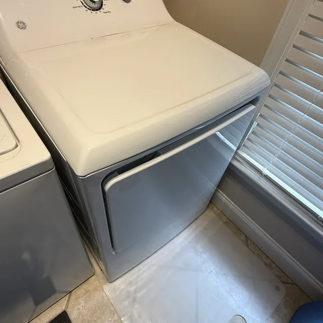 GE dryer pulled onto a floor protector mat in a Sunset Hills Greensboro laundry