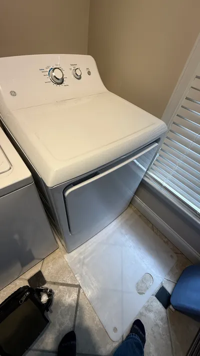 GE dryer pulled onto a floor protector mat in a Sunset Hills Greensboro laundry