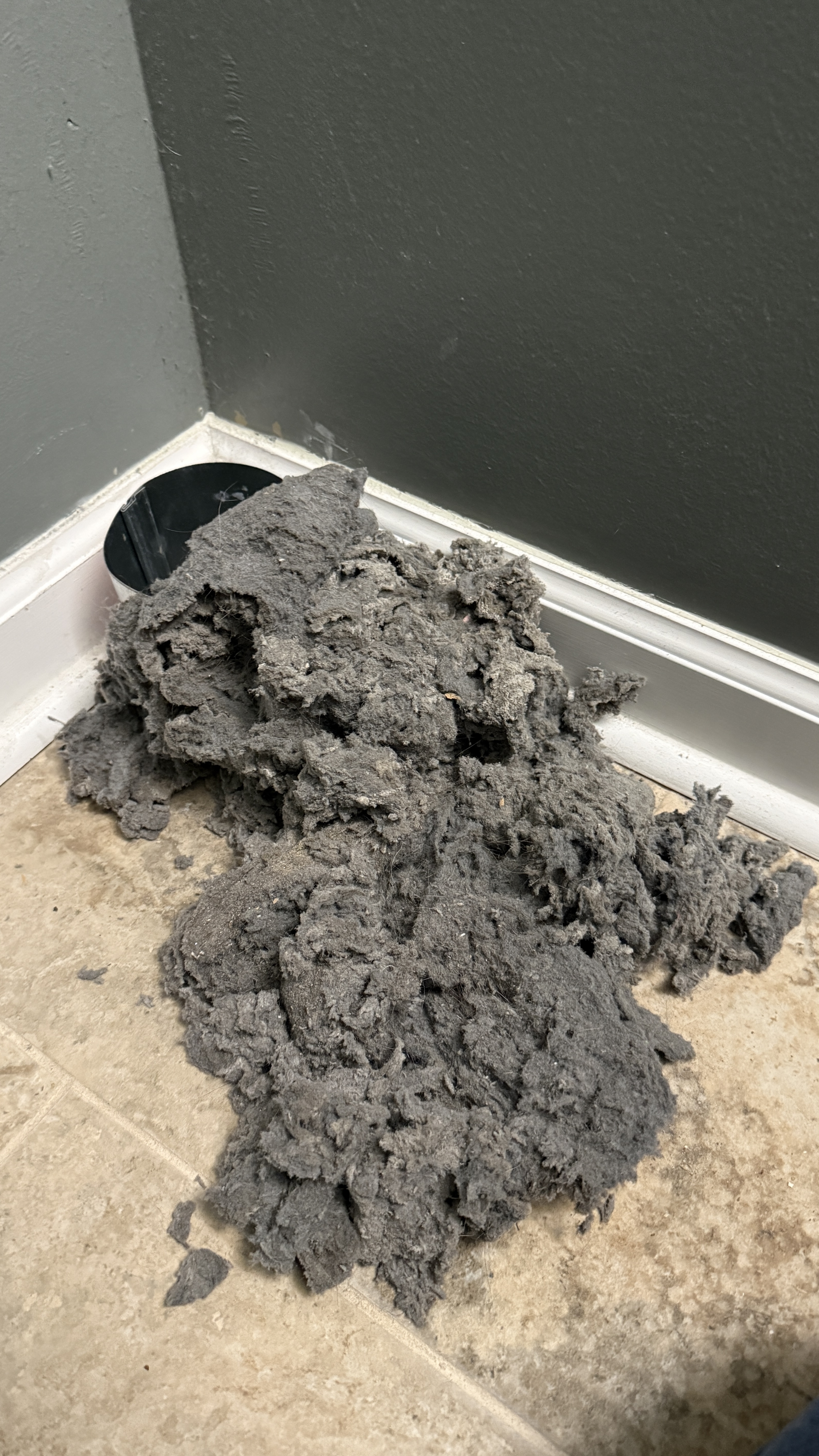 Large pile of lint removed from a dryer vent system after professional cleaning