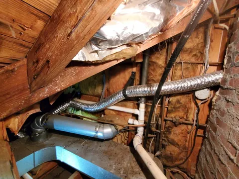 Flexible dryer vent in High Point attic