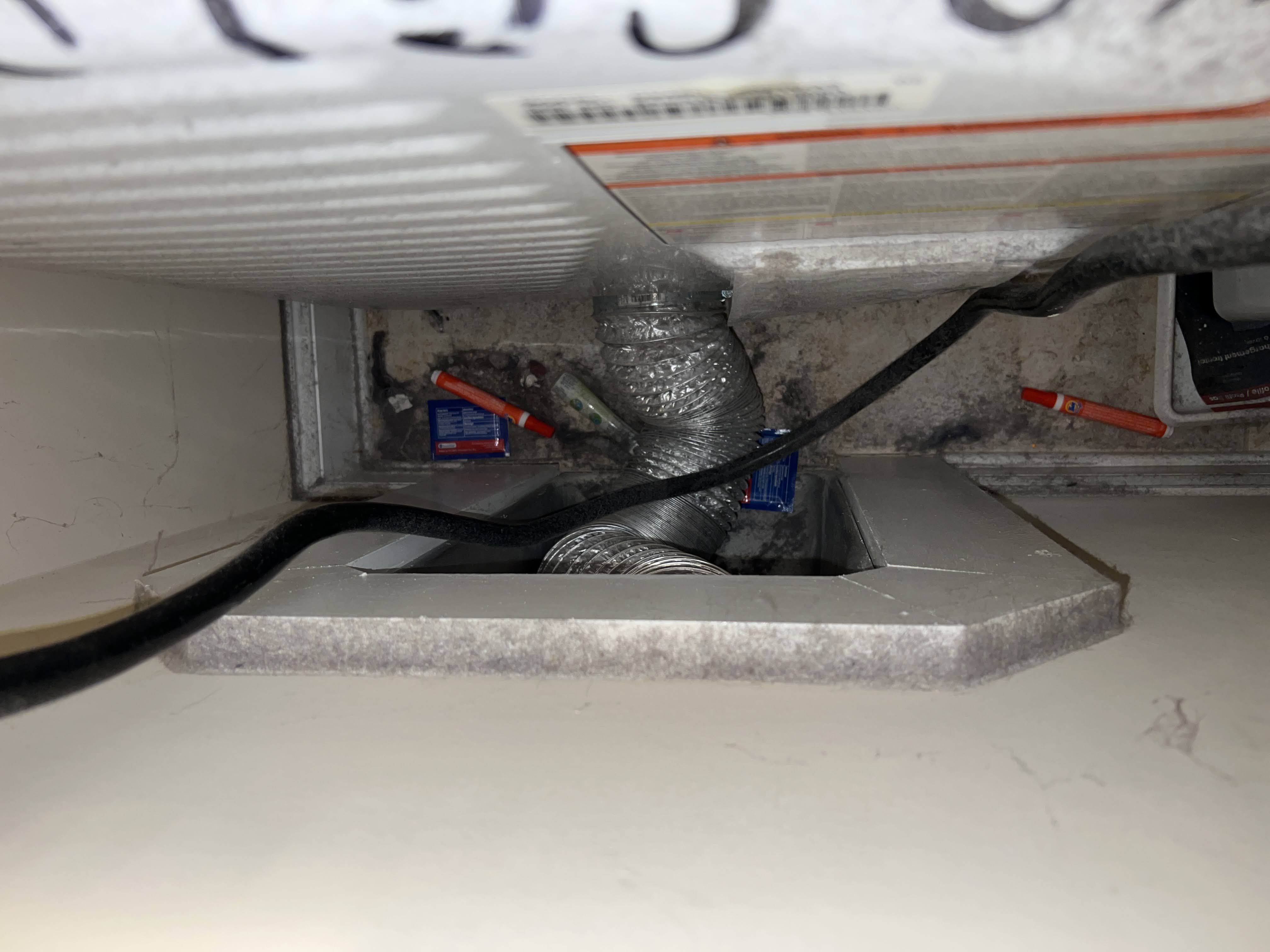 Debris and lint behind dryer Ashley Woods Gibsonville