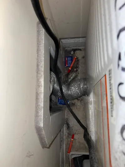 Debris and lint behind dryer Ashley Woods Gibsonville