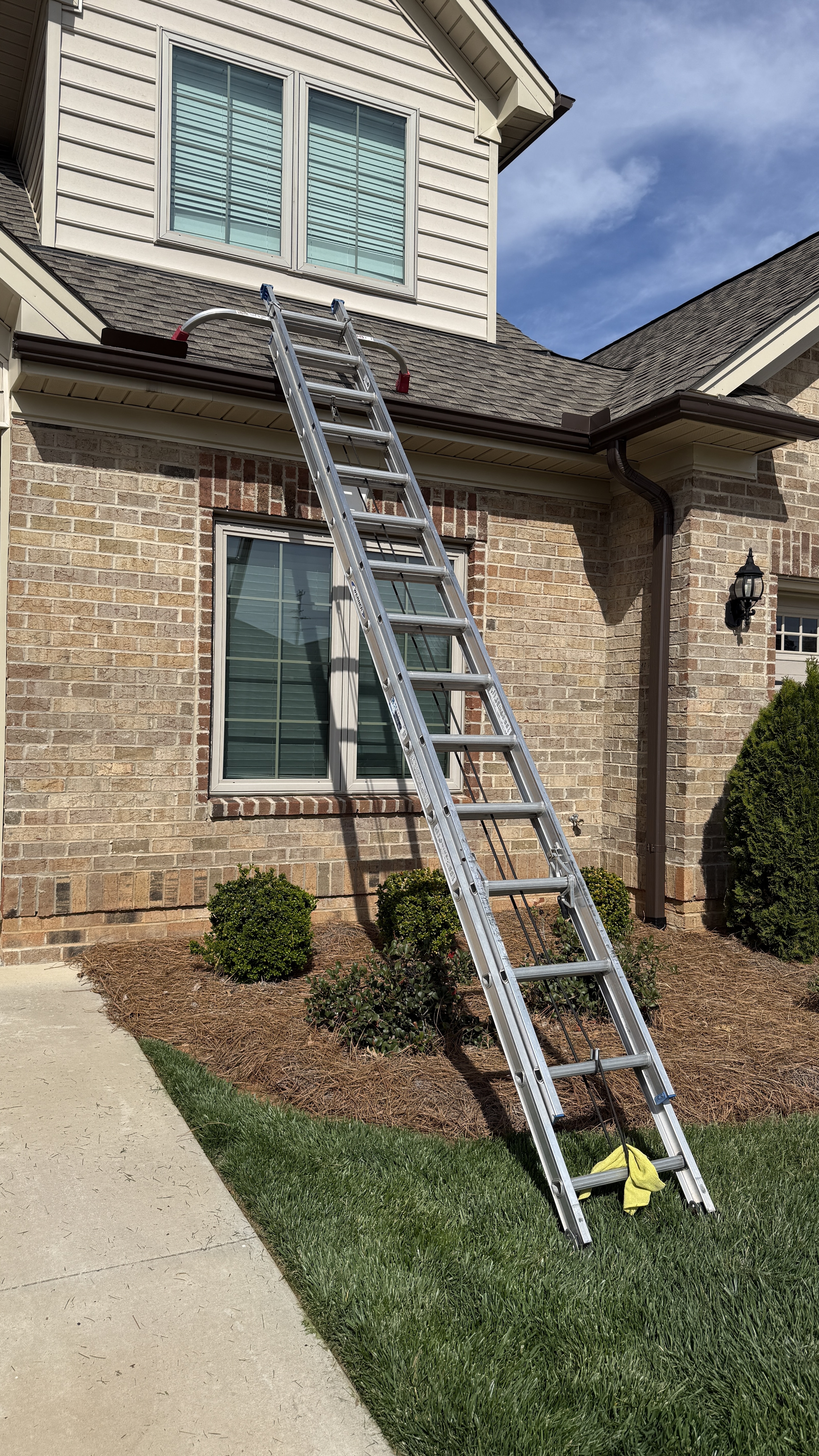 Ladder setup to access roof cover safely at The Trellises