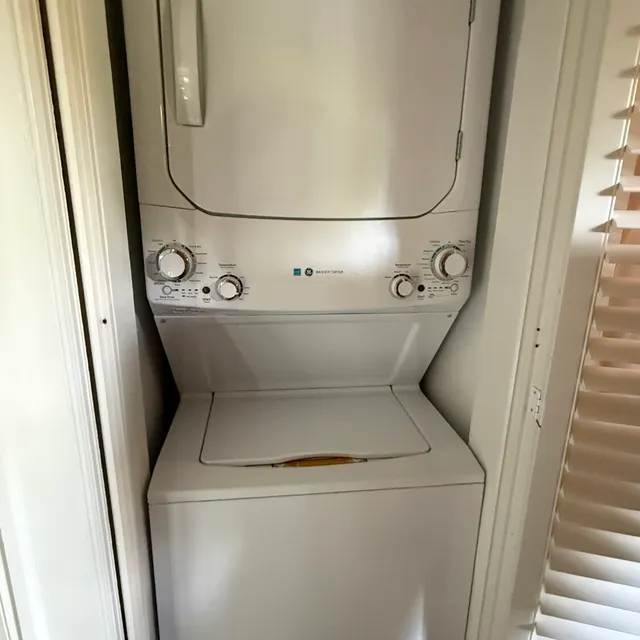 Stacked GE laundry center in a tight Westerwood Greensboro closet