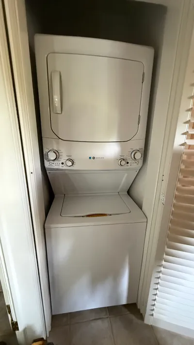 Stacked GE laundry center in a tight Westerwood Greensboro closet