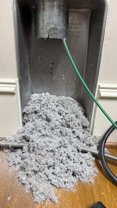 Lint pile pulled from a gas dryer vent in Old Irving Park Greensboro