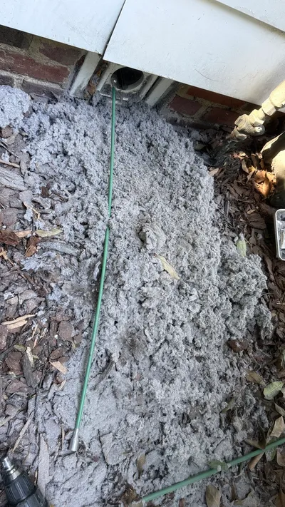 Large lint pile blown out under a Westerwood dryer vent cover