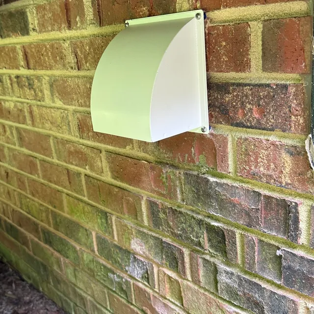 New pest-proof metal dryer vent cover under a deck in New Irving Park Greensboro