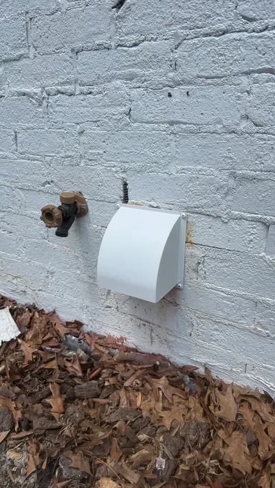 New metal dryer vent cover with painted stainless screws in Old Irving Park
