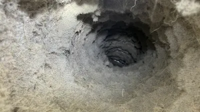 Lint and hair packed inside old flex dryer vent from Creekridge Eden