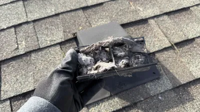 Lint packed in a roof vent damper from a nearby west Greensboro job