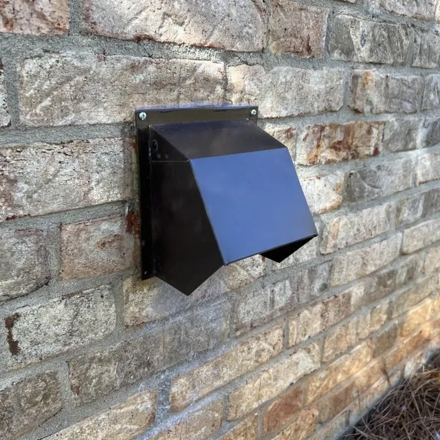Powder-coated metal dryer vent hood on home exterior