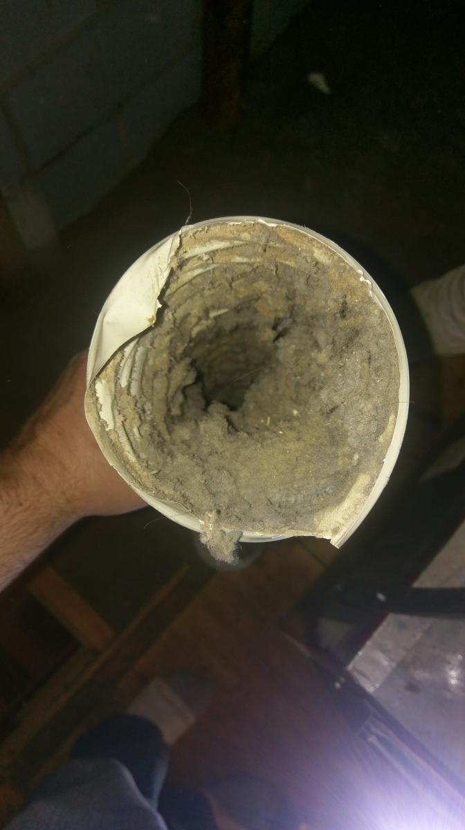 Plastic dryer vent clogged with lint