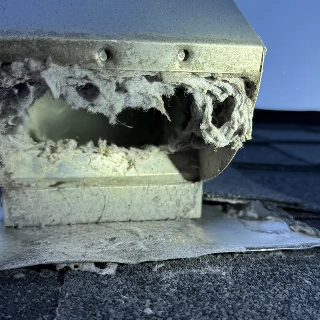 Roof dryer vent cover packed with lint in Reedy Fork Ranch Greensboro