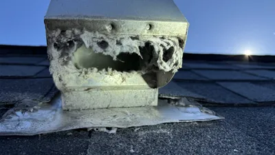 Roof dryer vent cover packed with lint in Reedy Fork Ranch Greensboro