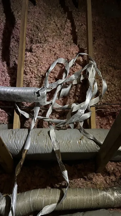 Torn flex vent in attic