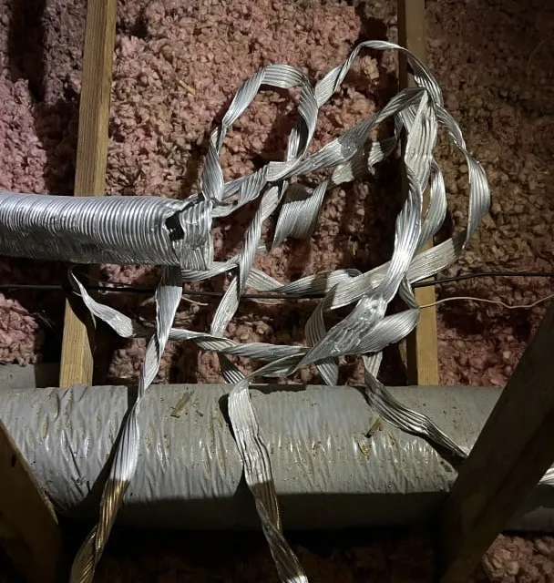 Torn flex vent in attic