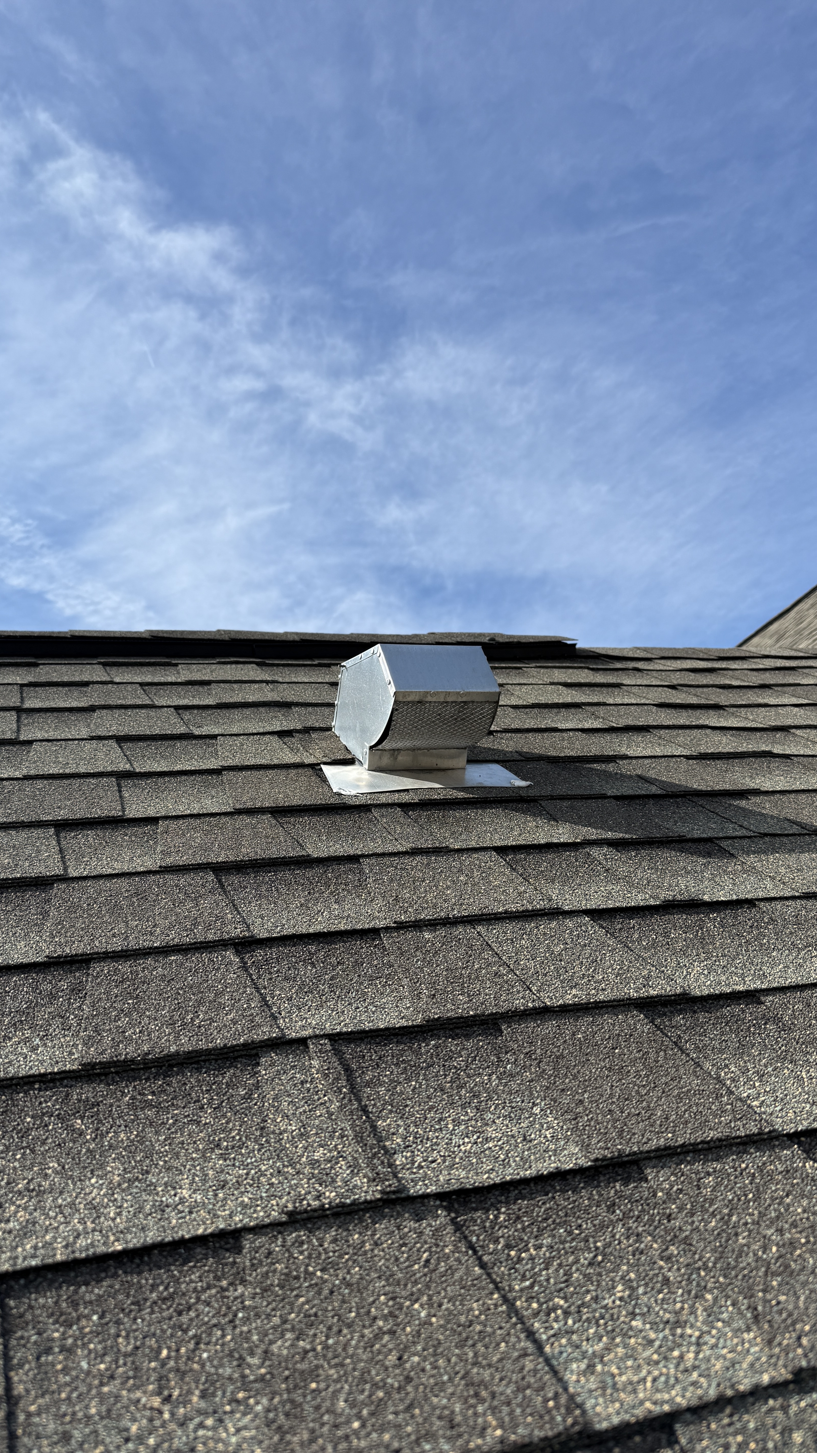 Roof dryer vent cover at The Trellises townhomes