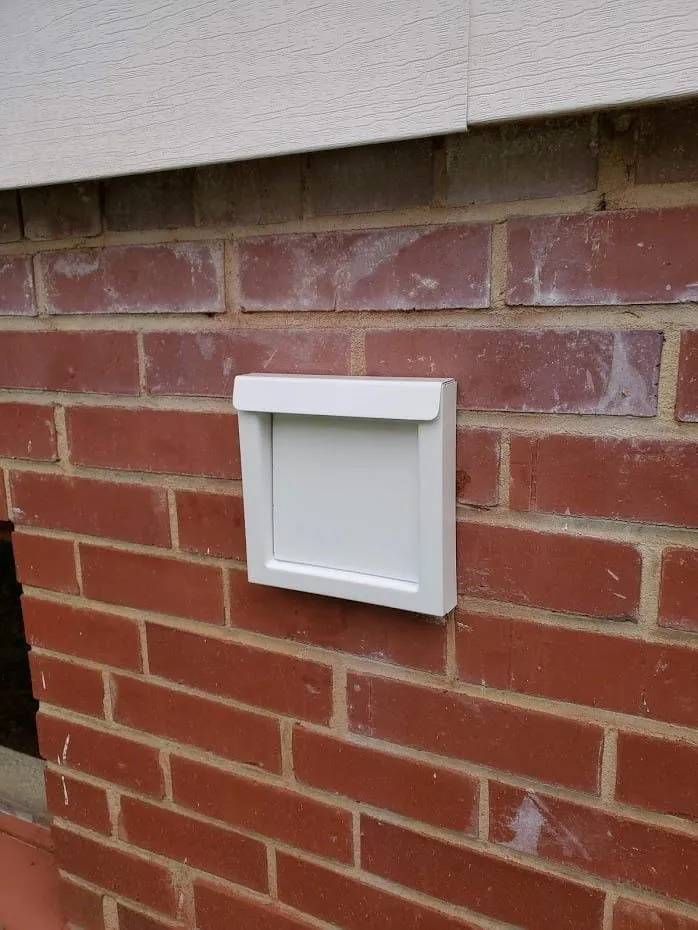 Wall vent installation on brick