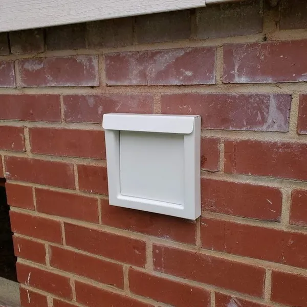 Wall vent installation on brick