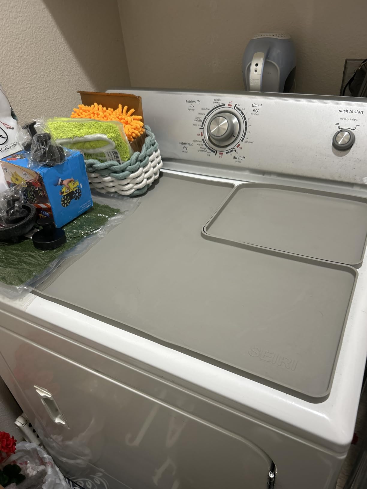 Silicone protective mat on top of a Whirlpool dryer