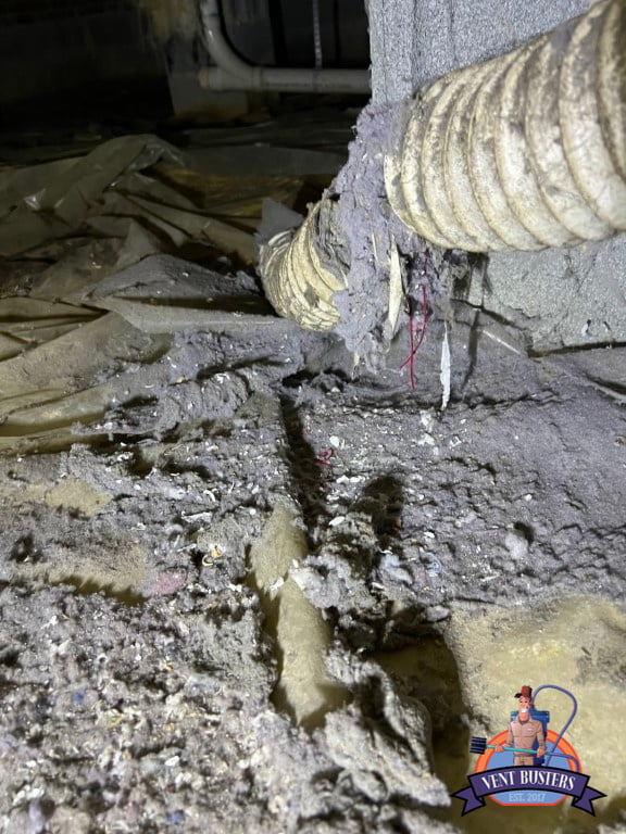Dirty crawlspace with dryer lint buildup