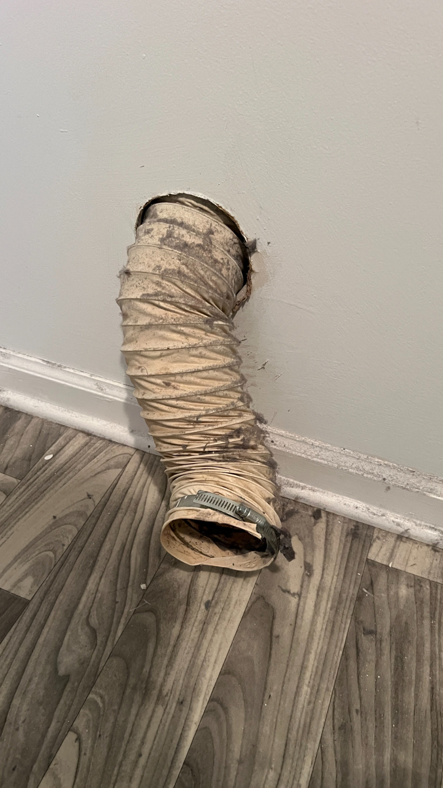 Plastic flex hose from wall at Sycamore Winston Salem